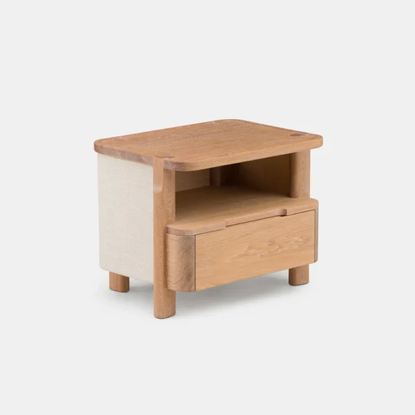 TWENTY-FIVE UPHOLSTERED BEDSIDE TABLE